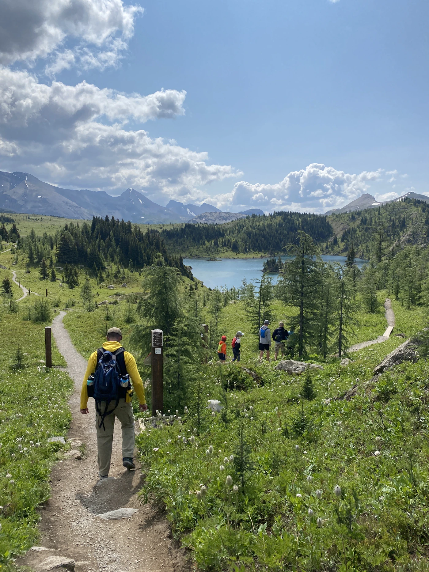 Group of hikers on a trail to Rock Isle Lake near Banff National Park