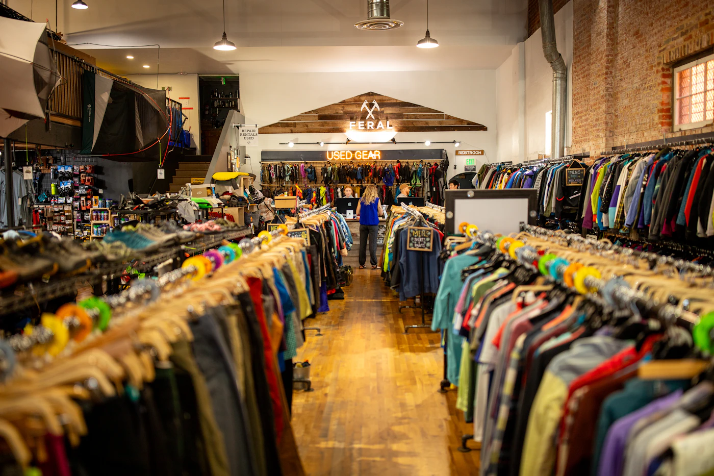 Shopper browsing shelves in an outdoor gear store